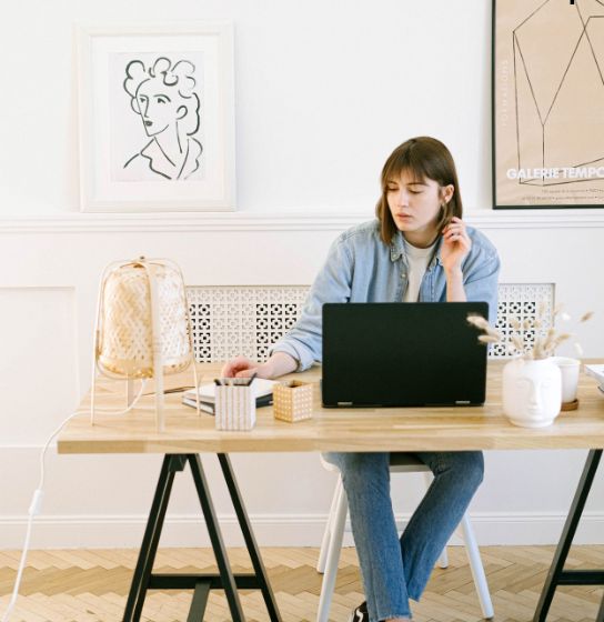 Lady at her desk writing for her home improvement blog