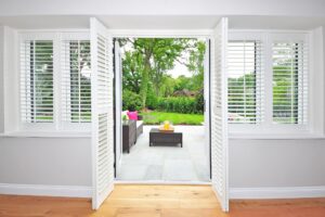 Plantation shutters on windows to the outside living area