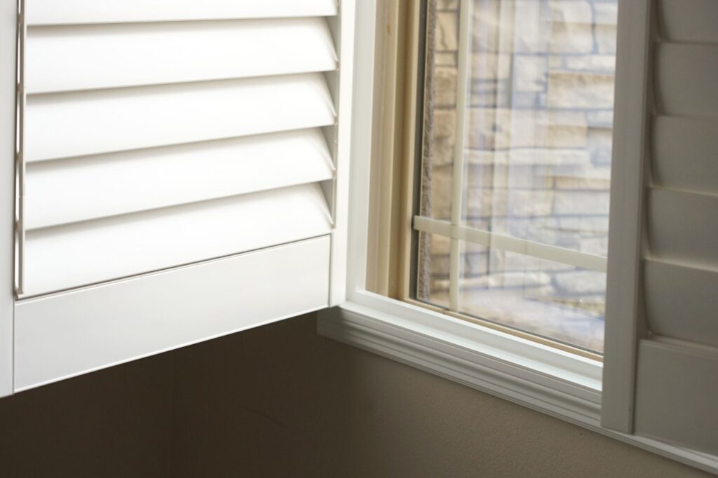 Open plantation shutters on the window