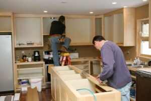 Two man working on a kitchen remodel