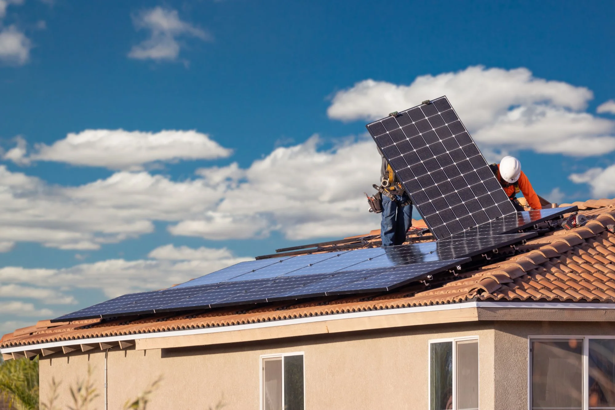 Solar panels being installed on a roof